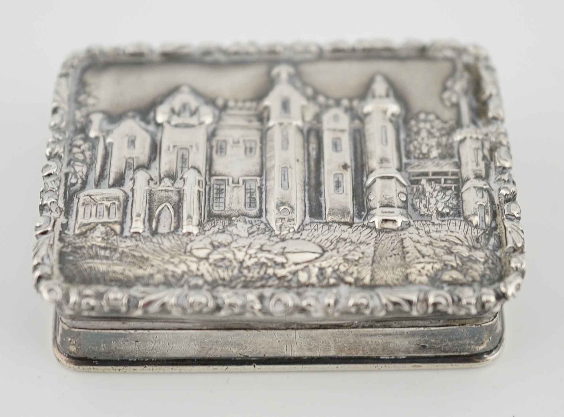 An early Victorian silver rectangular 'castle top' vinaigrette, depicting Abbotsford House, by Edward Smith